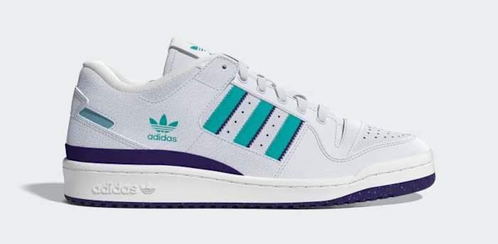 Side view of a white, teal, and purple adidas shoe.